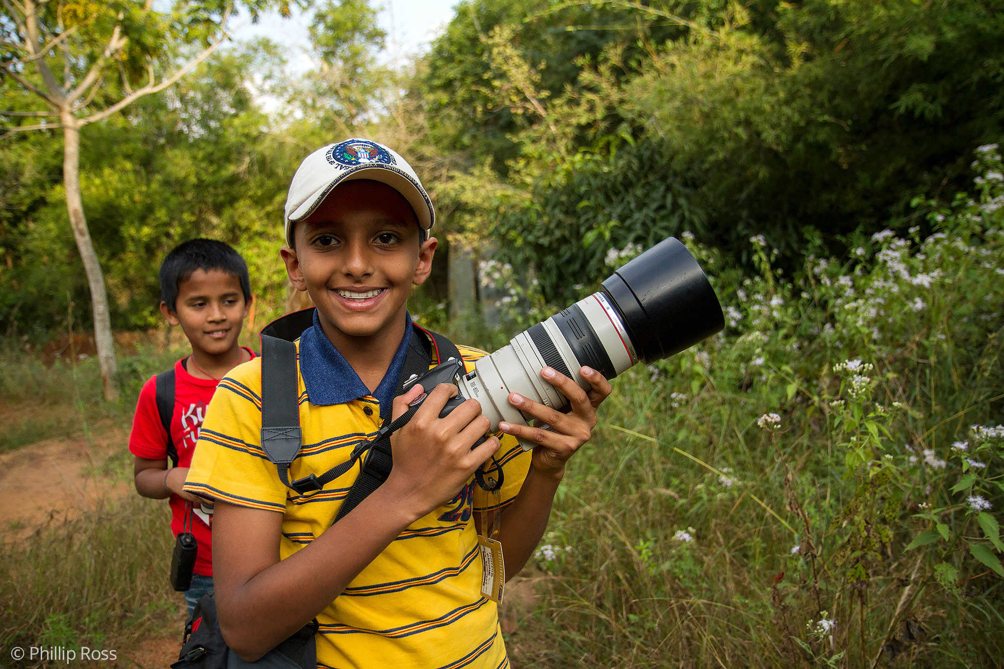 A young boy looking for birds on our Kids Photography Workshop in Bangalore